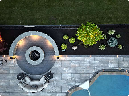 Aerial view of a modern patio with fire pit and pool