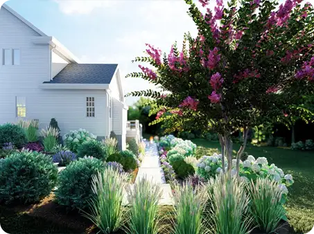 Exquisite garden bed with colorful flowers, bushes, and a beautifully landscaped walkway.
