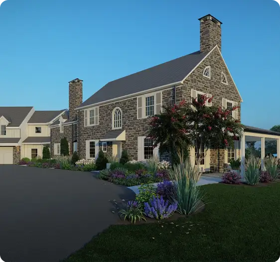 Beautiful front yard renovation with fresh plantings and mature trees framing a stunning stone house.