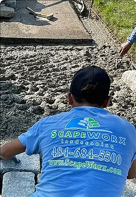 ScapeWorx team installing hardscape with precision.