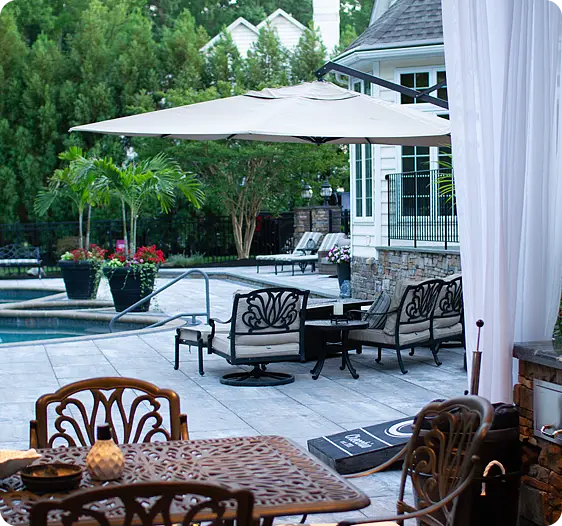 Elegant outdoor patio with seating area and pool view
