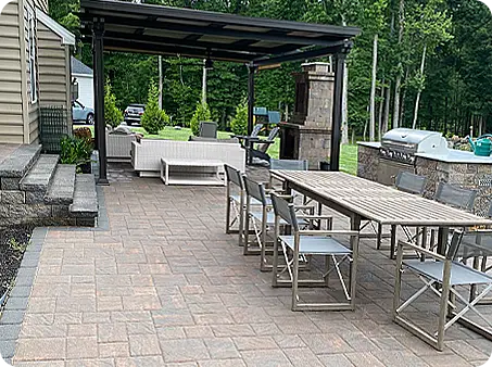 Elegant patio with outdoor dining area and covered seating