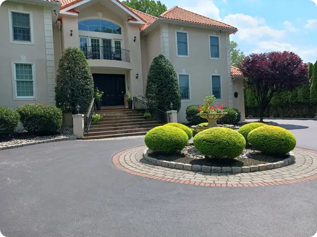 Freshly trimmed shrubs and bushes enhancing front yard landscaping