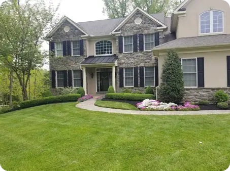 ScapeWorx spring clean up with fresh mulching and trimmed landscape