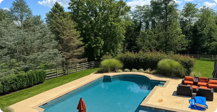 ScapeWorx designed backyard with a beautiful swimming pool and elegant landscaping in West Chester.