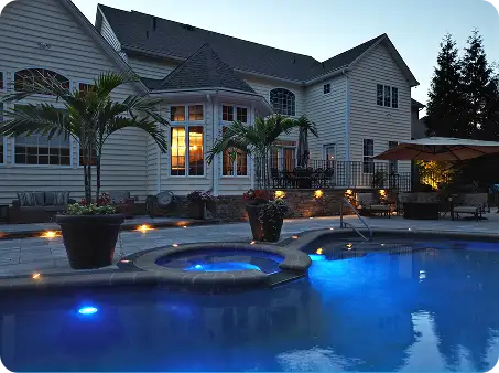 ScapeWorx transforms a backyard into a resort-style retreat with a pool and patio.