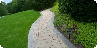 ScapeWorx designed and installed a curving paver walkway with landscape lighting in West Chester.