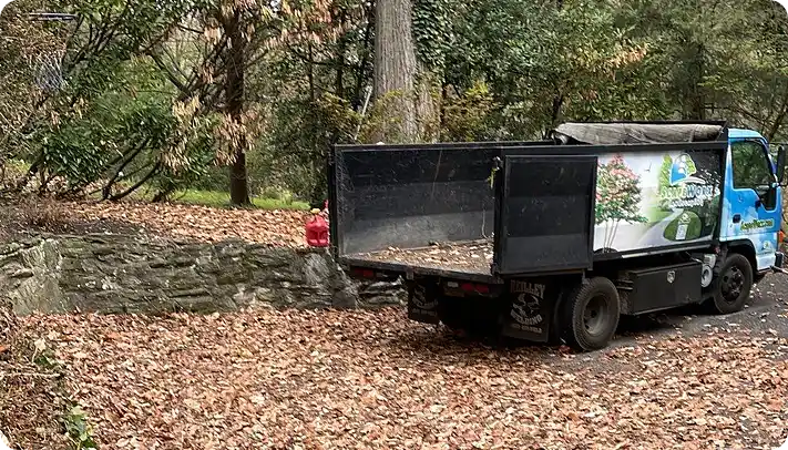 ScapeWorx truck during Aston fall clean up collecting leaves