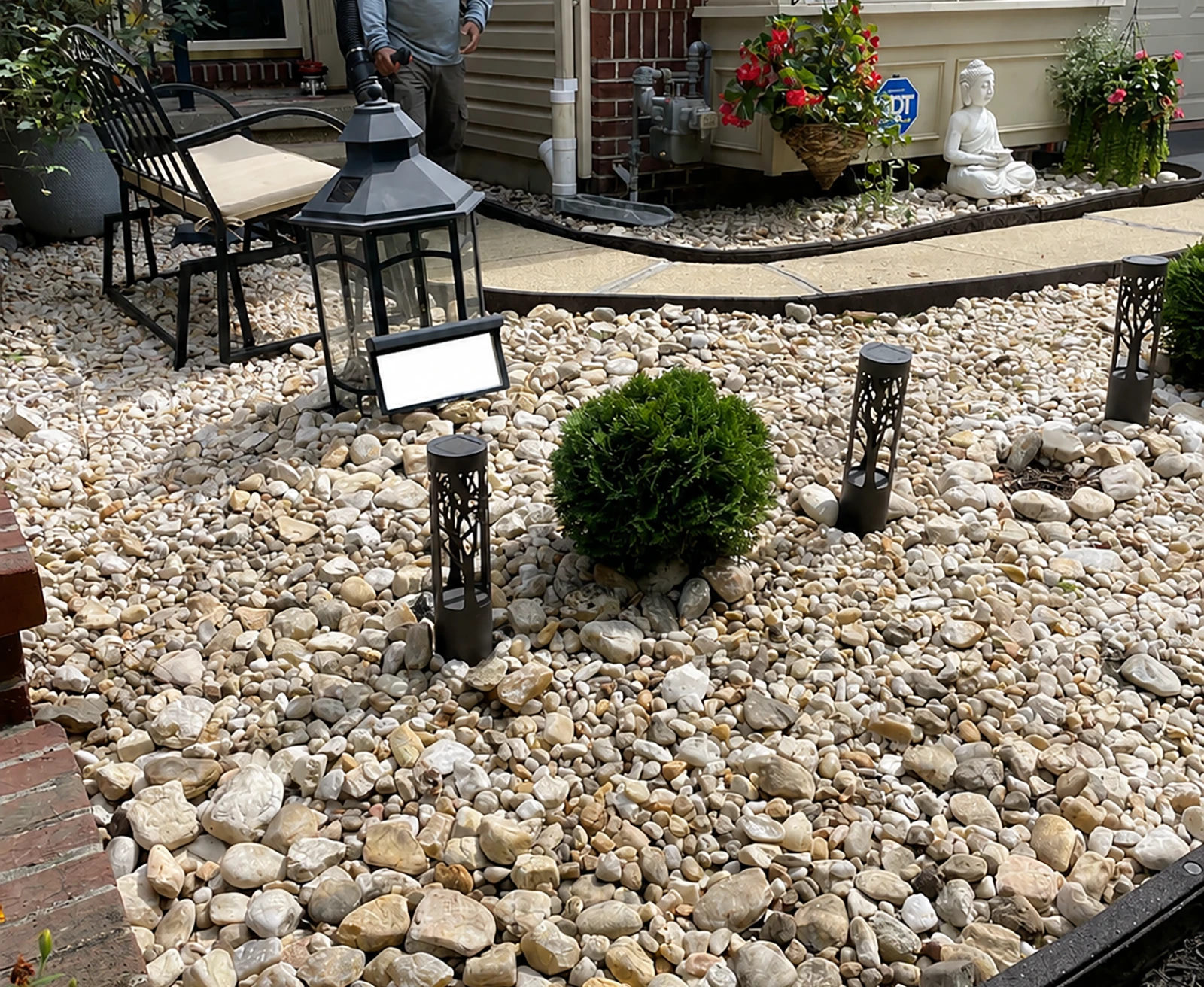 ScapeWorx graded stone drainage bed beside a home