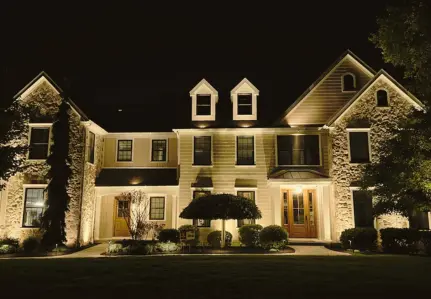 ScapeWorx landscape lighting illuminating an elegant home at night