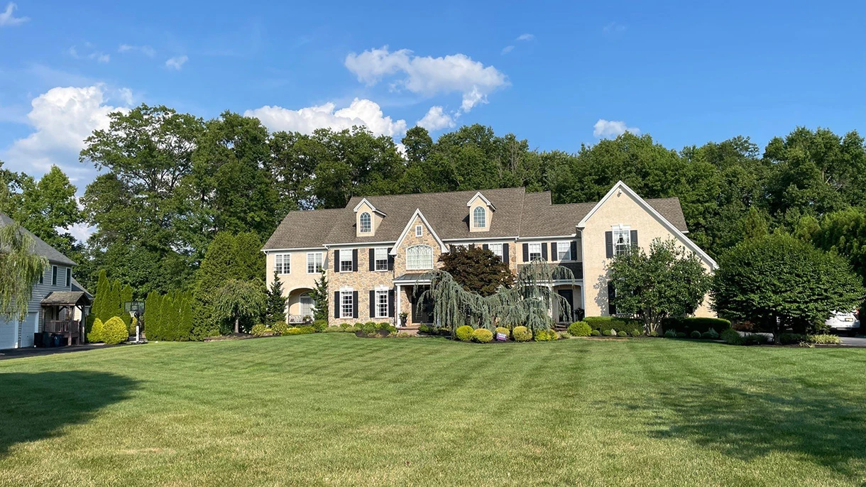 Garnet Valley home seen across a wide striped lawn
